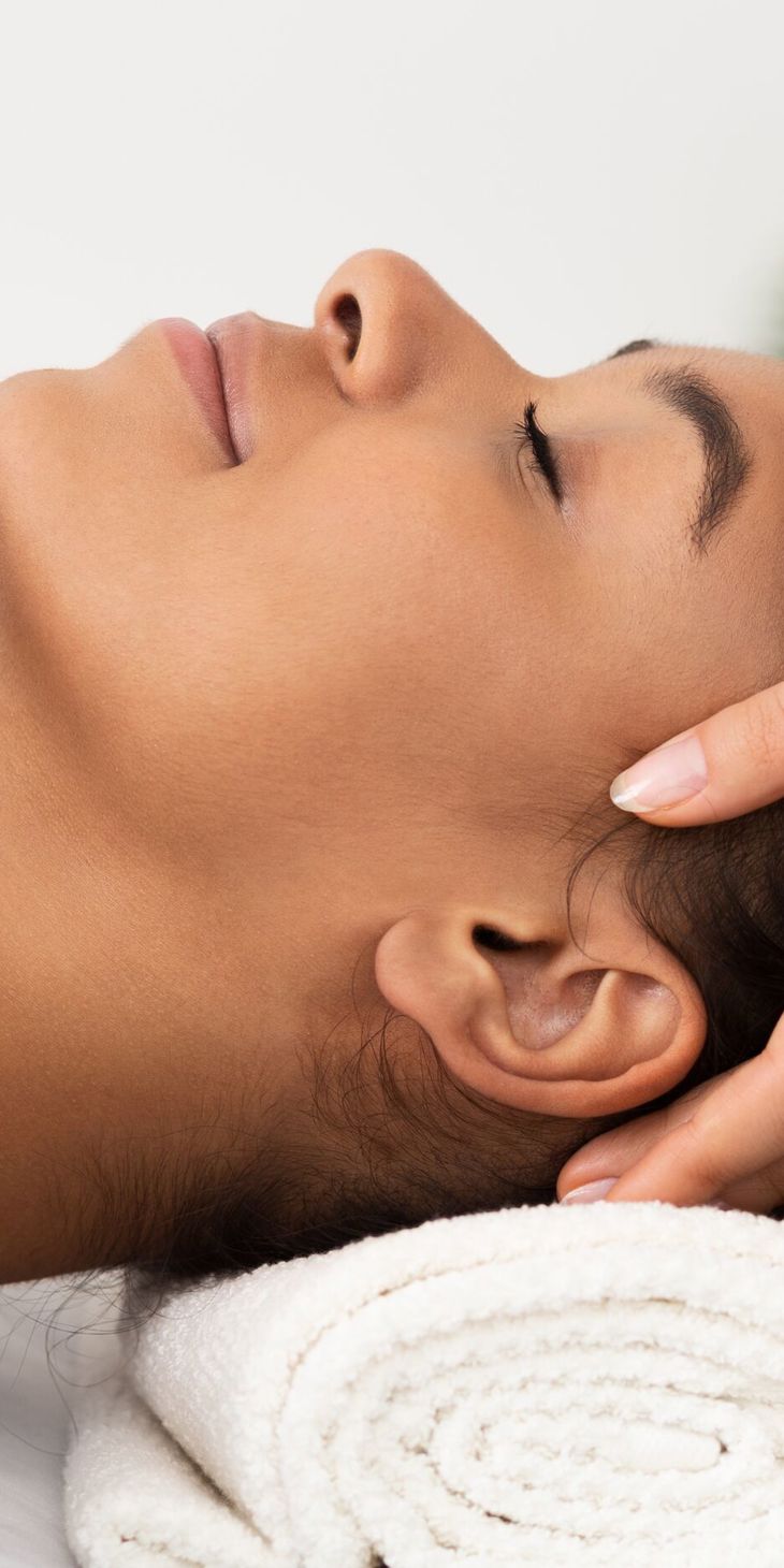 Relaxing Massage. Afro Woman Receiving Head Massage At Spa Salon, Side View