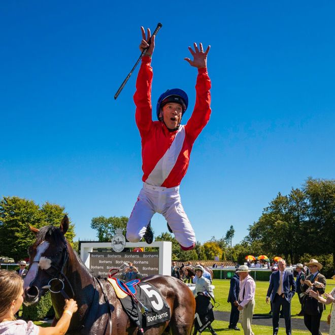 Frankie Dettori leaps from Regal Reality (5) after winning The Bonhams Thoroughbred Stakes on the fourth day of the Qatar Goodwood Festival, QGF2018.Picture date: Friday August 3, 2018..Photograph by Christopher Ison ©.07544044177.chris@christopherison.com.www.christopherison.com