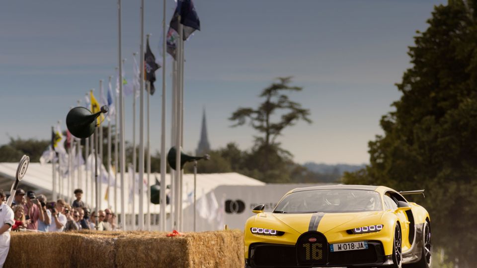 Fans watch action on the hill at Goodwood Festival of Speed..Picture date: Friday July 9, 2021..Photograph by Christopher Ison ©.07544044177.chris@christopherison.com.www.christopherison.com..IMPORTANT NOTE REGARDING IMAGE LICENCING FOR THIS PHOTOGRAPH: This image is supplied to the client under the terms previously agree. No sales are permitted unless expressly agreed in writing by the photographer.