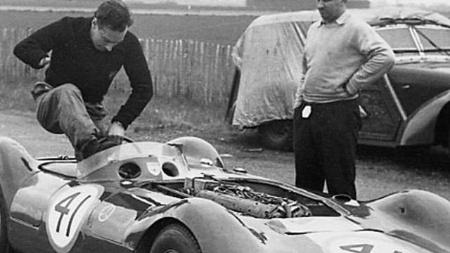 Scott Brown with no right hand and short legs - Brian Lister (right) and their Lister-Maserati sports car, 1956.