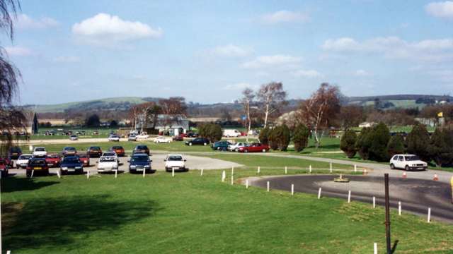 The paddock area looking to the north with the Downs beyond, finishing straight and pits area to the right…