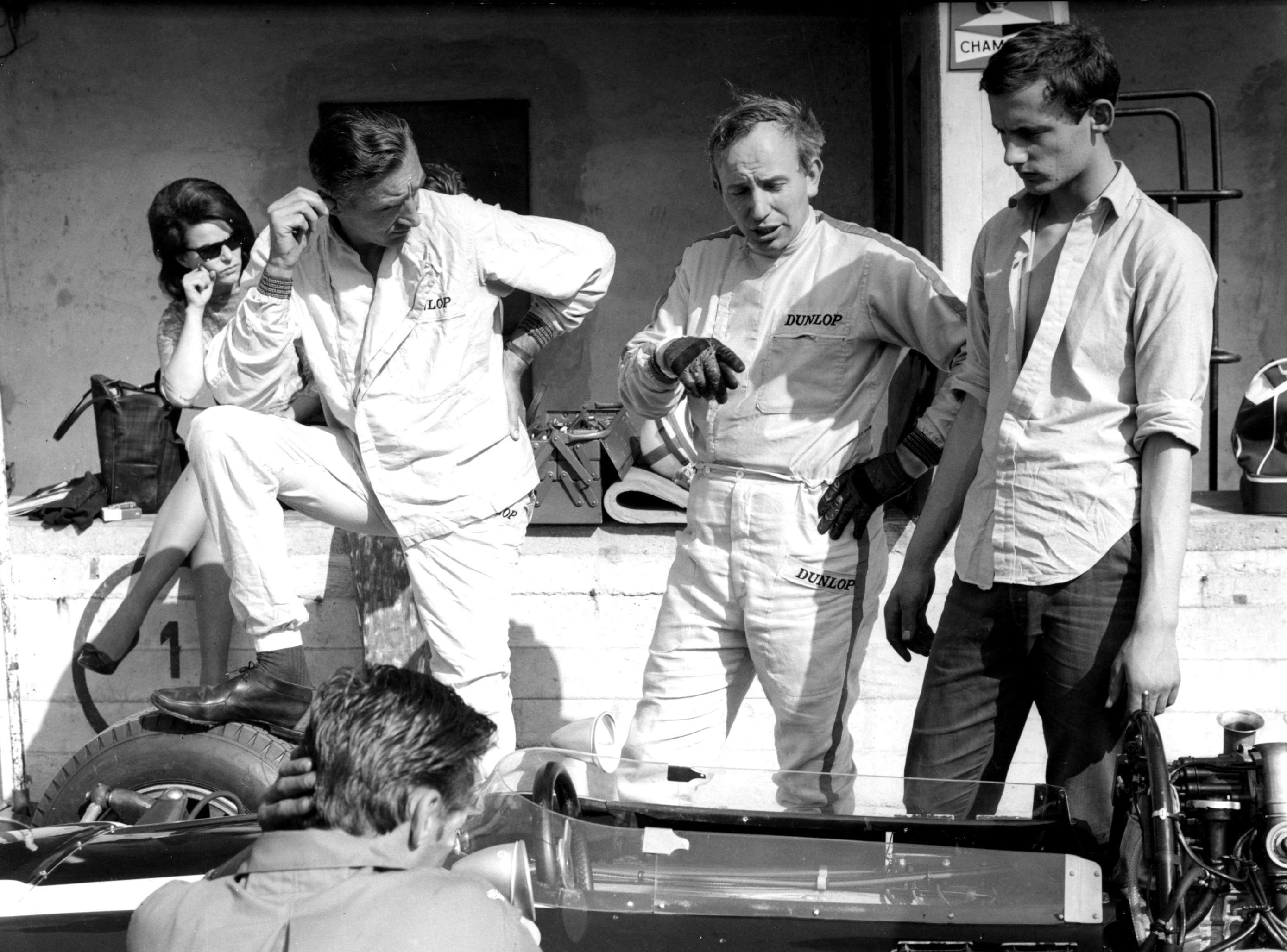 Monza - Italian GP 1966 - John Surtees holding forth to Cooper-Maserati team manager Roy Salvadori (left). One did not argue with John. It was a pointless exercise...’