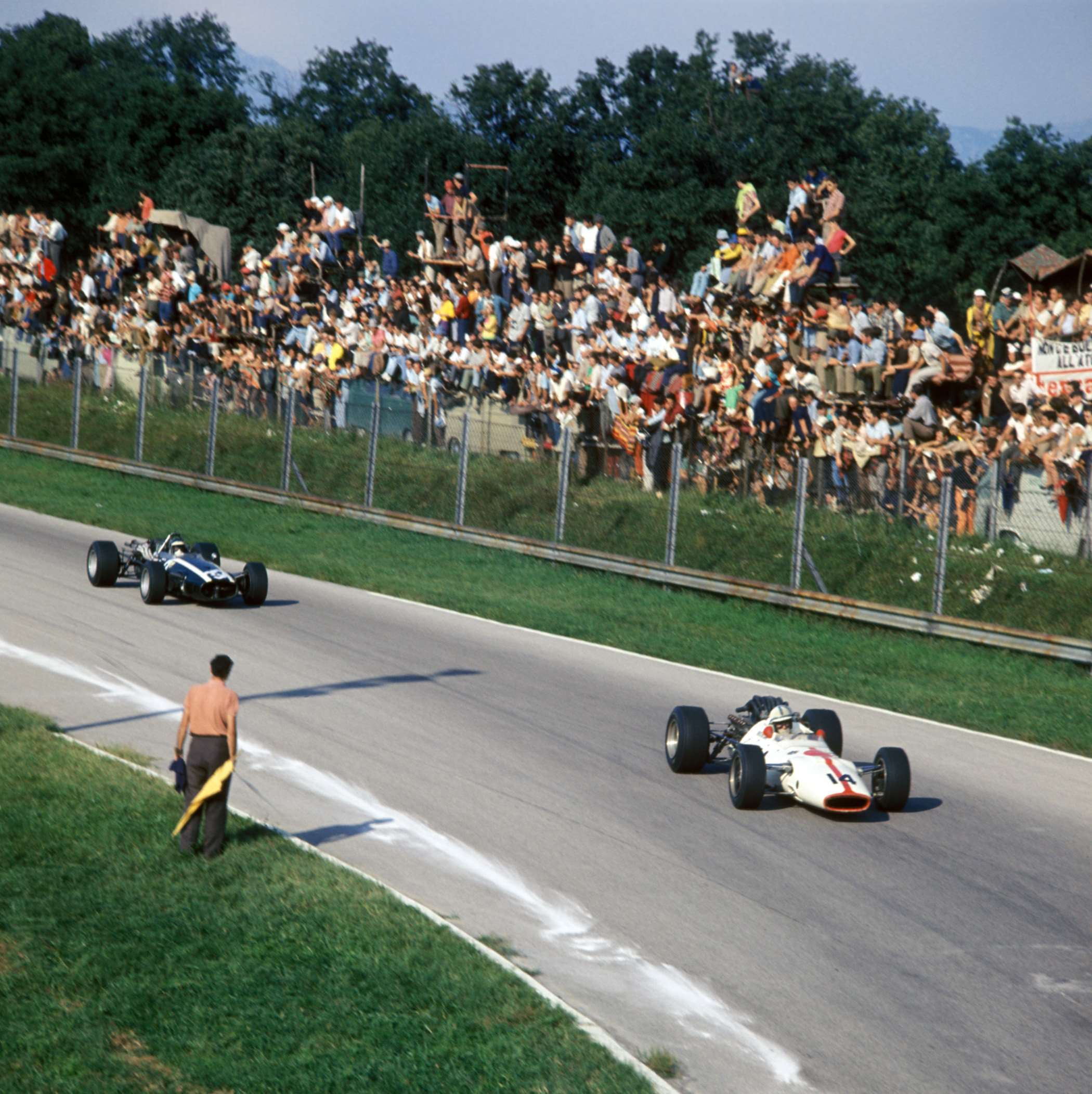 1967 Italian GP at Monza - John hurling the big Hondola V12 into the Curva Parabolica - he won another Italian GP, just by inches from Jack Brabham - the two hardest men in contemporary Formula 1 duelling it out wheel-to-wheel. 