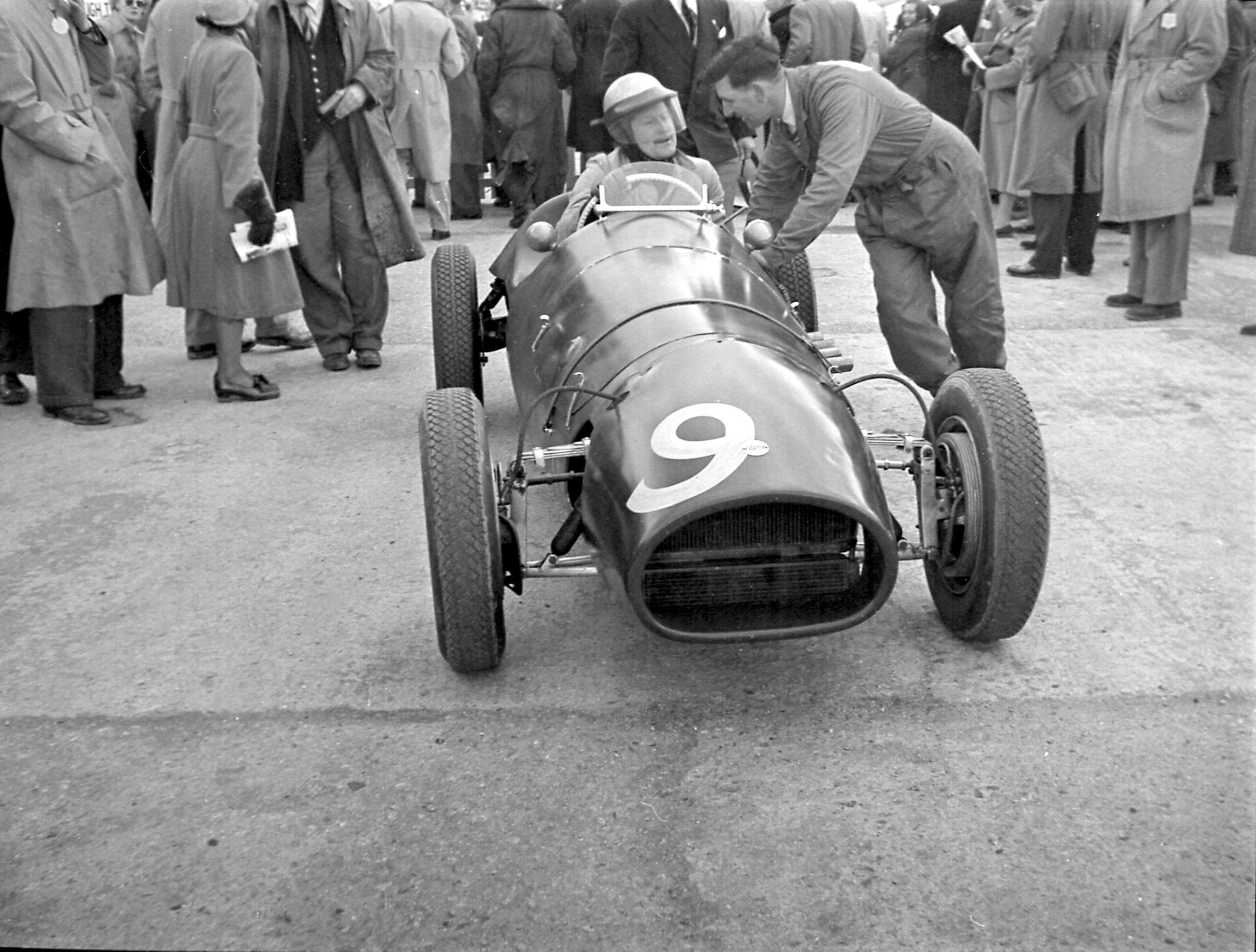 Paul Emery in the Equipe Anglaise Cooper-Alfa Romeo - Goodwood assembly area