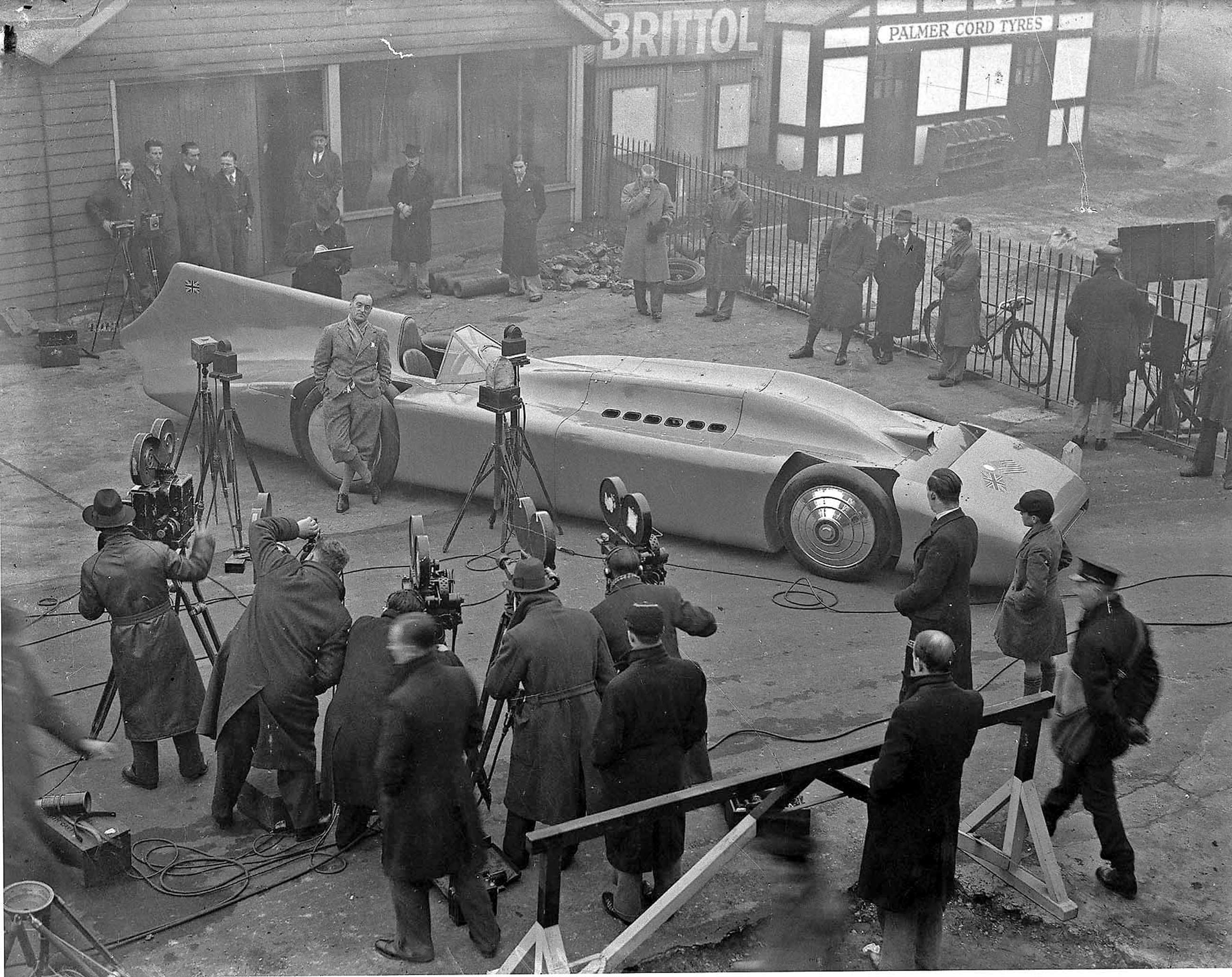 Malcolm Campbell showing his re-packaged ‘Bluebird’ to the press at Brooklands, 1935. The 5-ton car had a 36.6-litre, 2,350bhp Rolls-Royce engine and carried Campbell to 272.46mph on Daytona Beach, then beyond 300mph - a new LSR at 301.129mph - on the salt at Bonneville.