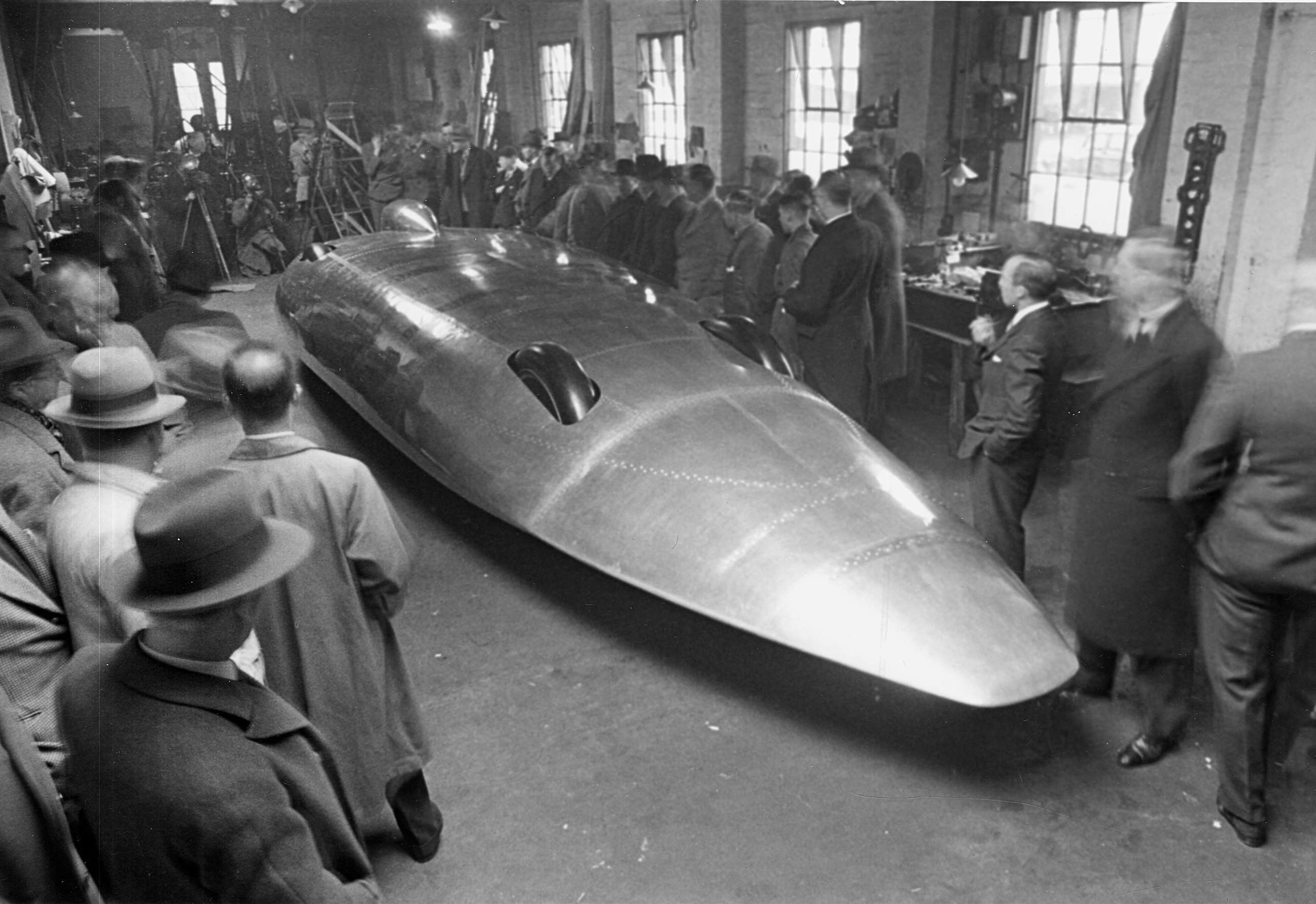 John Cobb duelled with Eyston for the record, 1938-39, in his 47.9-litre, 2,500bhp twin-Napier Lion-engined Railton Special, here being unveiled to the press at Thomason & Taylor’s works, Brooklands.