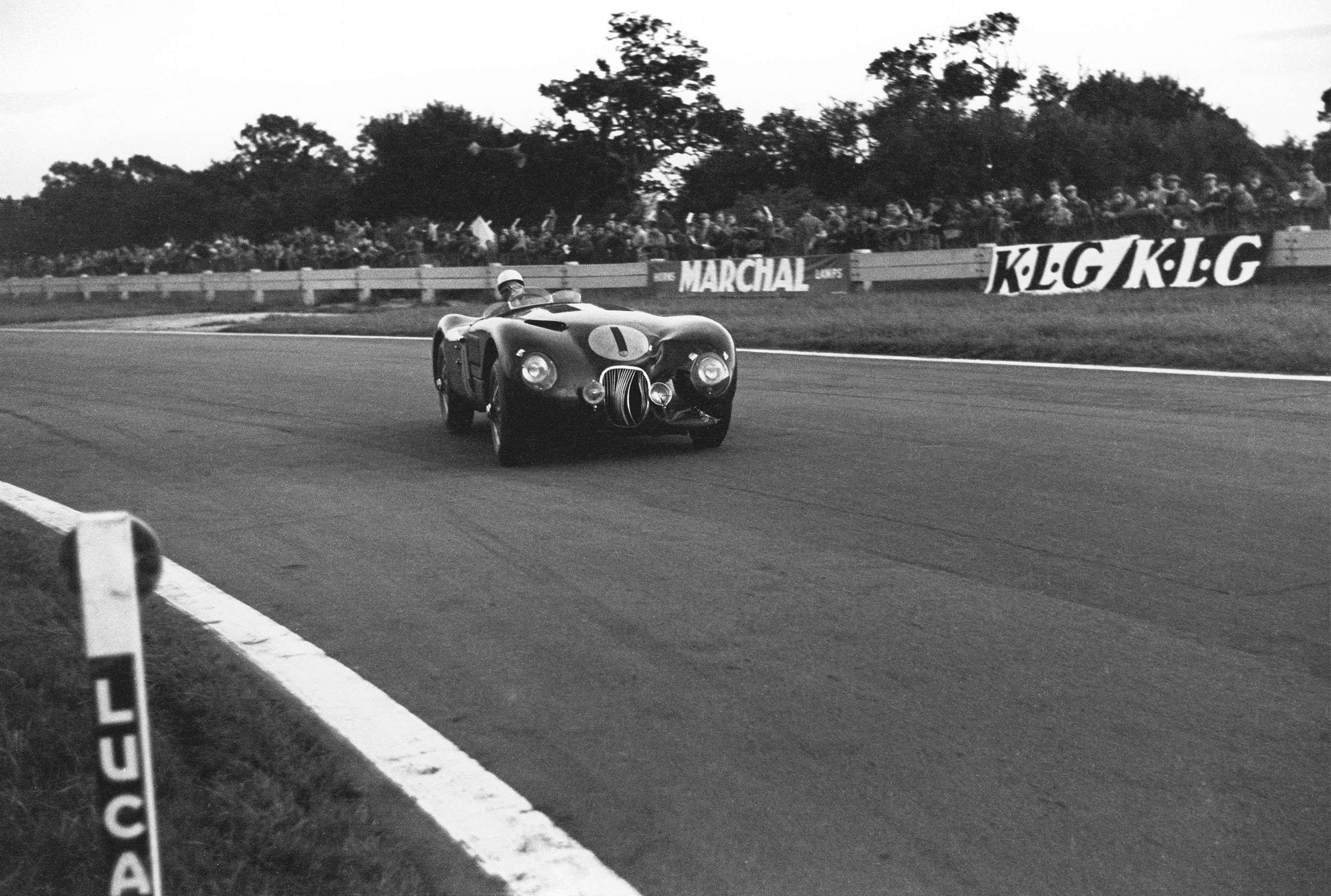 Moss at Goodwood for the Nine Hours, 1953, in the Jaguar C-Type that he would eventually retire.