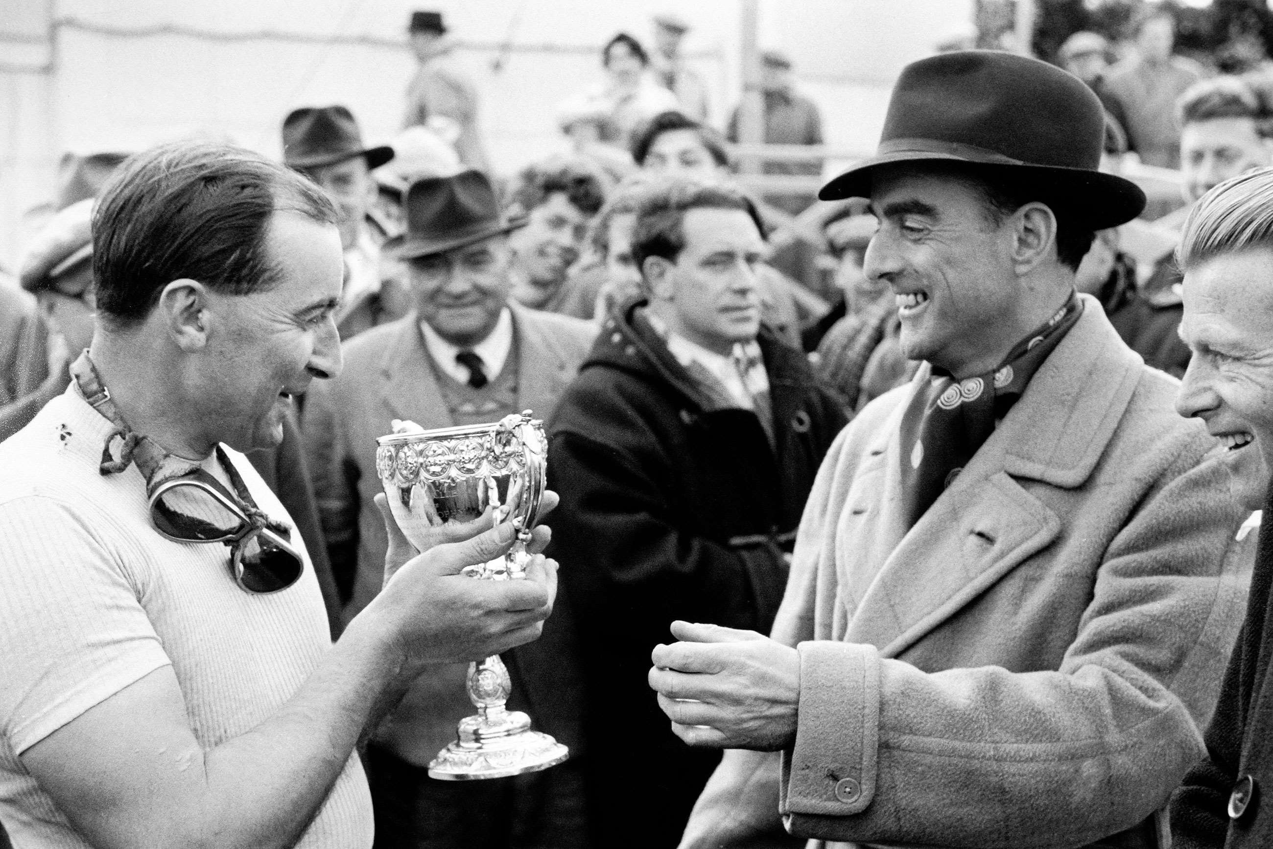 The 9th Duke of Richmond presenting Ken Wharton with a trophy, Goodwood, 1953.
