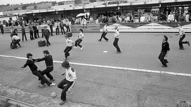 1980 Spanish Grand Prix – Brabham team plays football on the start-finish straight.jpg